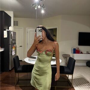 Elegant Green Satin Dress with Floral Accents